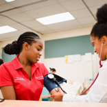 Rutgers Nursing students taking blood pressure