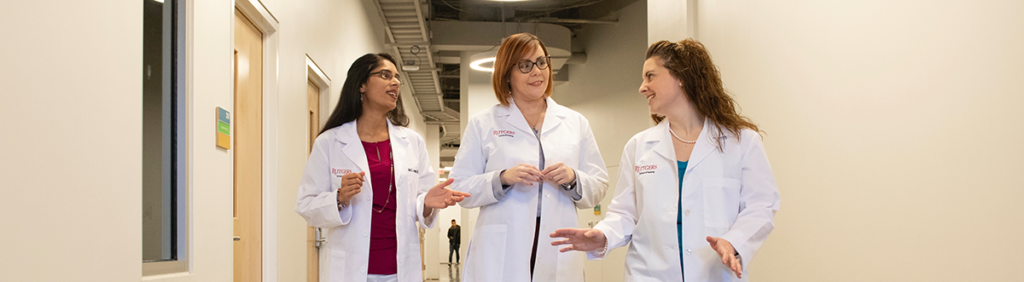 Rutgers Nursing PhD students in white coats