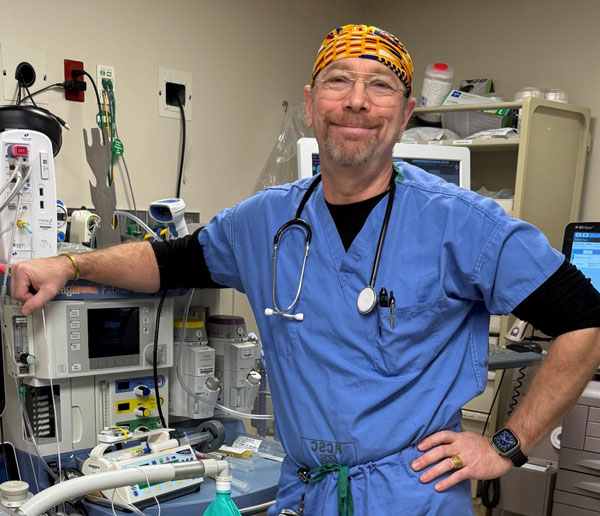 Sean Barnawell smiling in an Operating Room setting